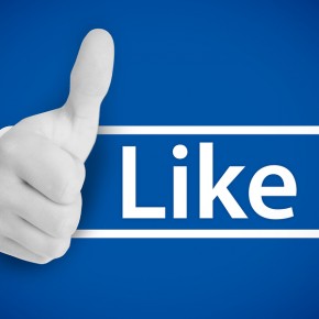 White thumb up next to the like from social networks on blue bac